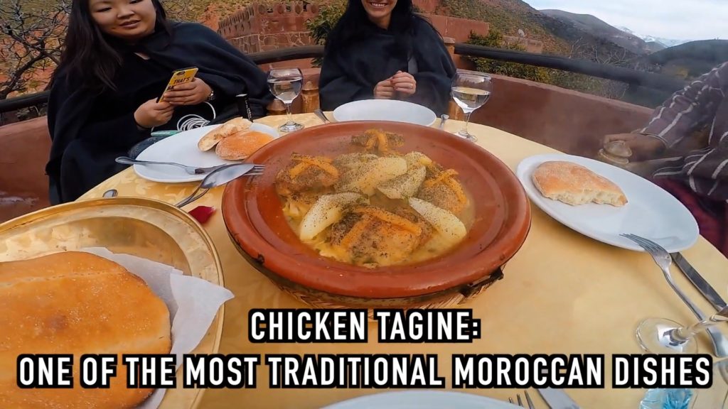 Moroccan chicken tagine is slow cooked in a ceramic pot with dried fruit and served with bread