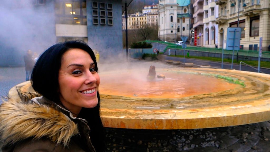 Karlovy Vary is famous for its mineral hot springs. You'll see people drinking from them regularly!