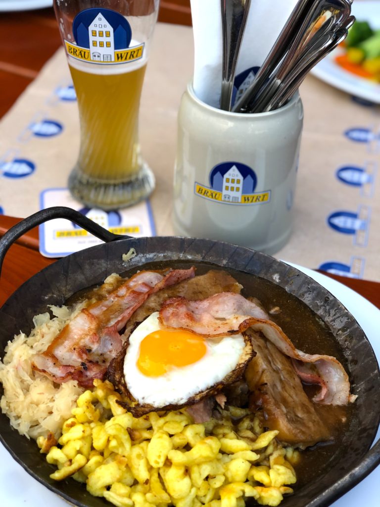 Braumeister Pfandl- pork with fried egg, bacon, butter spätzle, and sauerkraut at Bräu Wirt