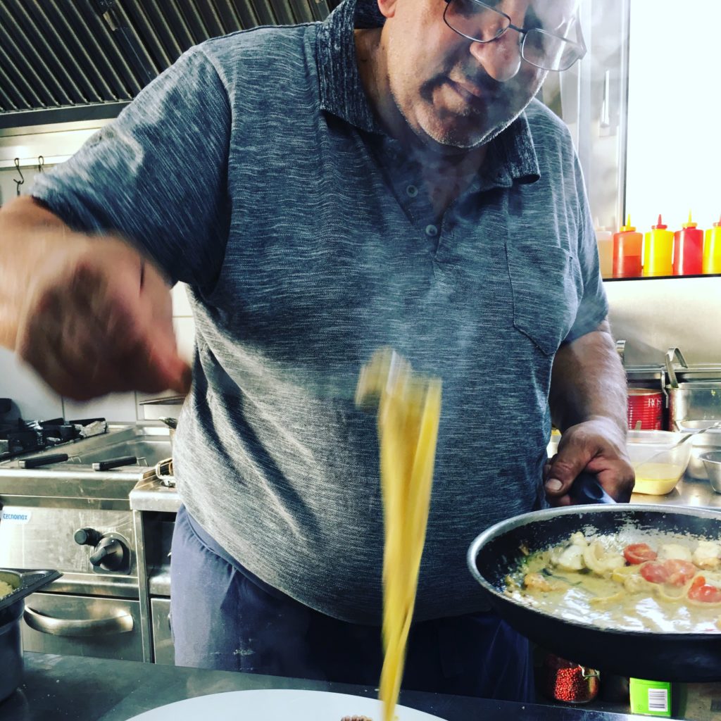 Family owned Weiden restaurants: Trattoria Bologna chef preparing a pasta dish