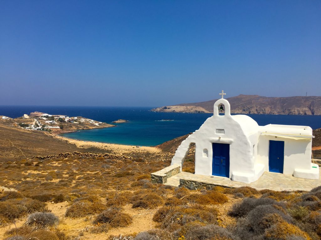 white chapel in front of Paralia Agios Sostis beach