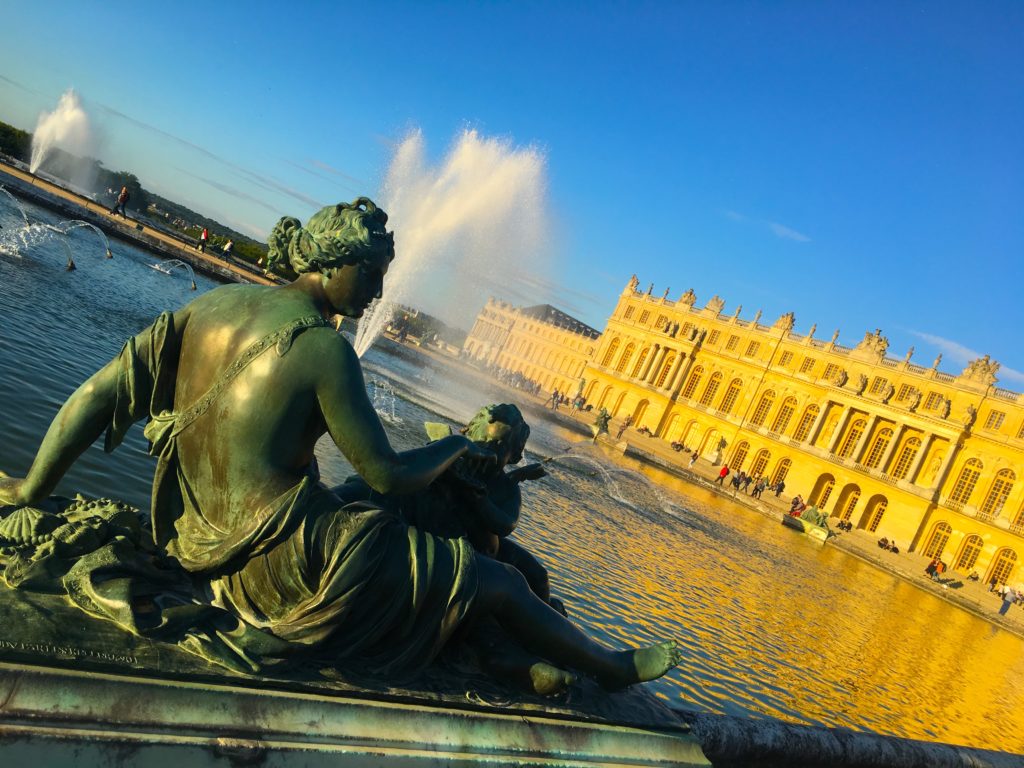 Statues and water fountains in the gardens of versailles france