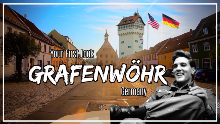 Your first look at Grafenwoehr photo in front of the Grafenwoehr Rathaus, water tower, US and German flag and Elvis Presley