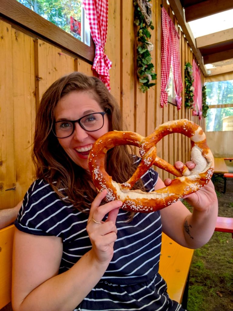 Woman with large pretzel at Bavarian festival