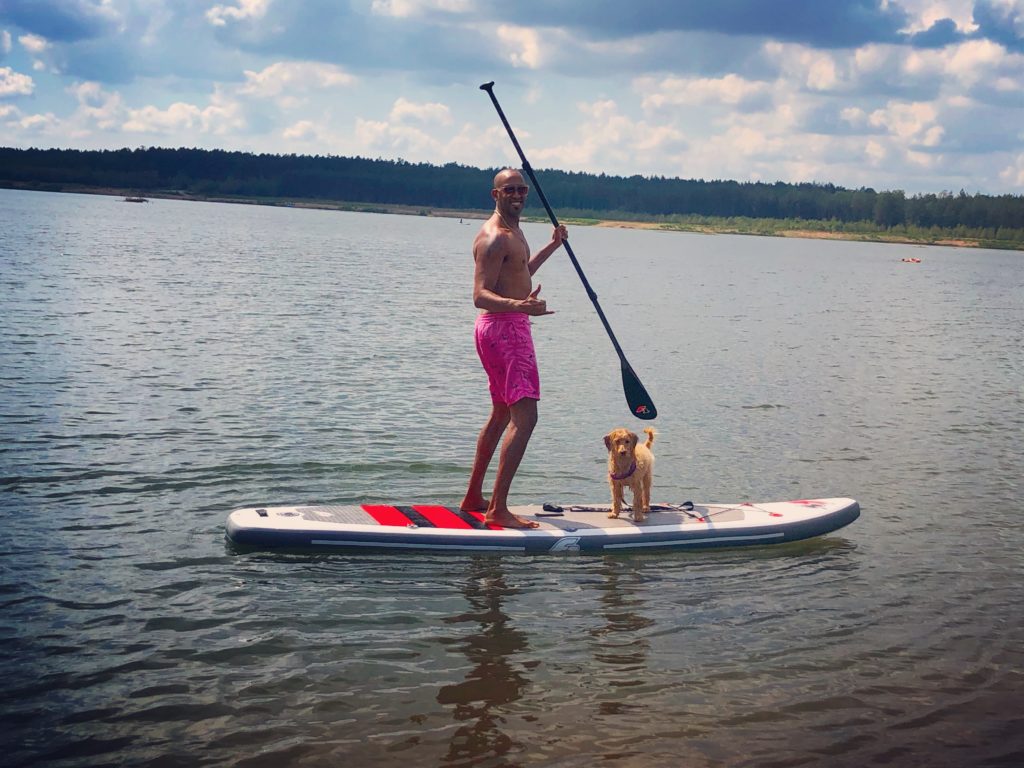 Paddle boarding with dog on the Freizeitsee Diesfurt. Easy day trip from Grafenwoehr Germany