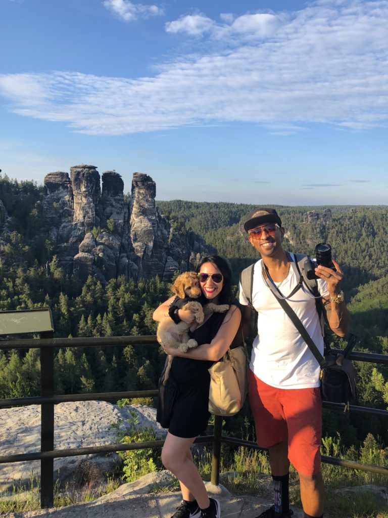 taking a picture in front of rock formation at bastei bridge