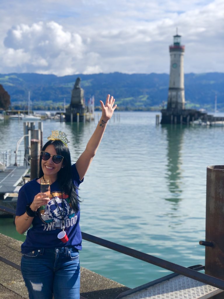 Taking pictures in front of the Bavarian lion and lighthouse on lindau island