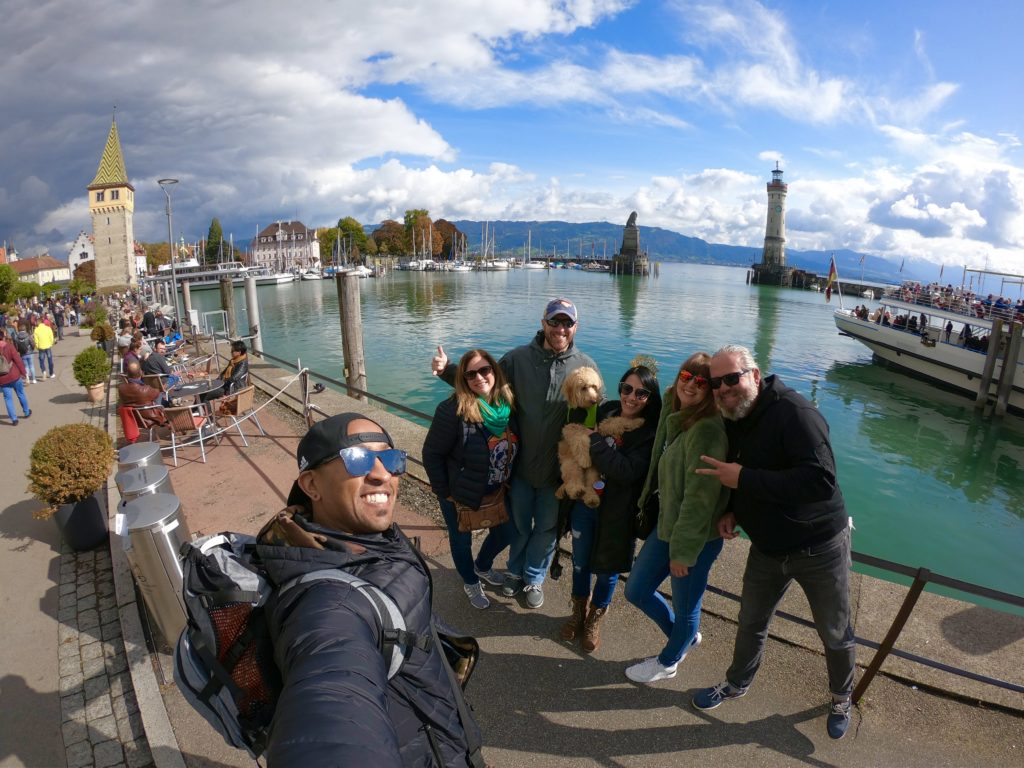 Taking photos with friends at the Lindau island harbor